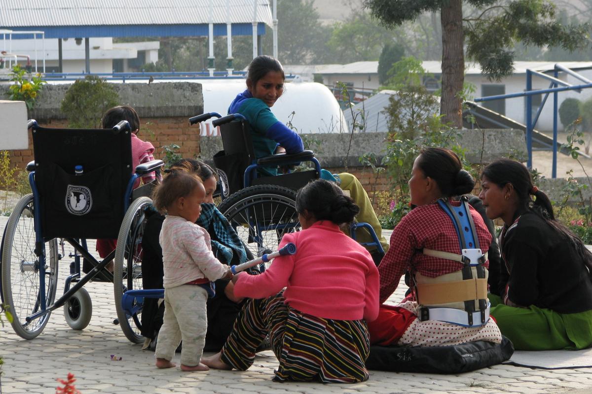 Female patients and caregivers gather in front of Nepal's SIRC in 2009