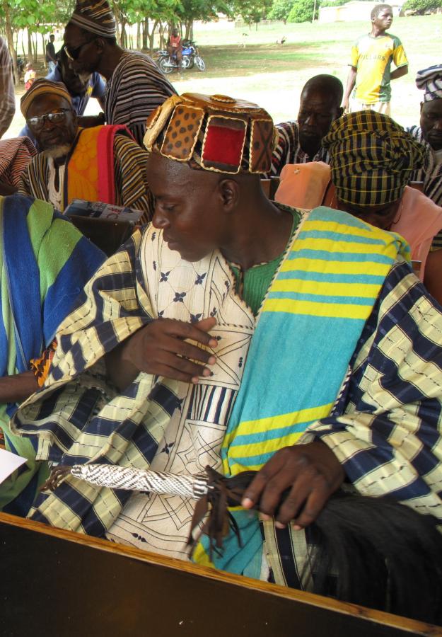 Chief Sakkodaan, gathered with elders, reading the books at the official Nabdam District Book Launch in Ghana 