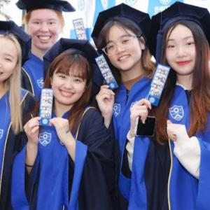 UBC student Tamano Nishida (left) with friends wearing Yonsei University’s graduation gown on the last day of class (photo: Tamano Nishida)