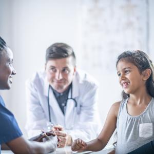 A mother and daughter having a consultation with two doctors (photo: FatCamera/iStock)
