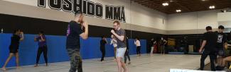 Students squaring-up and practicing traditional stances in the Muay Thai class at Toshido MMA