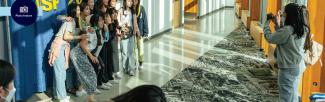 A group of VSP students takes pictures at the Welcome Day Event photo booth (photo: Bohdan Lee/Vancouver Summer Program)