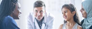A mother and daughter having a consultation with two doctors (photo: FatCamera/iStock)