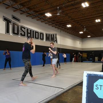 Students squaring-up and practicing traditional stances in the Muay Thai class at Toshido MMA (photo: UBC Okanagan Intercultural Sport Series) Students squaring-up and practicing traditional stances in the Muay Thai class at Toshido MMA