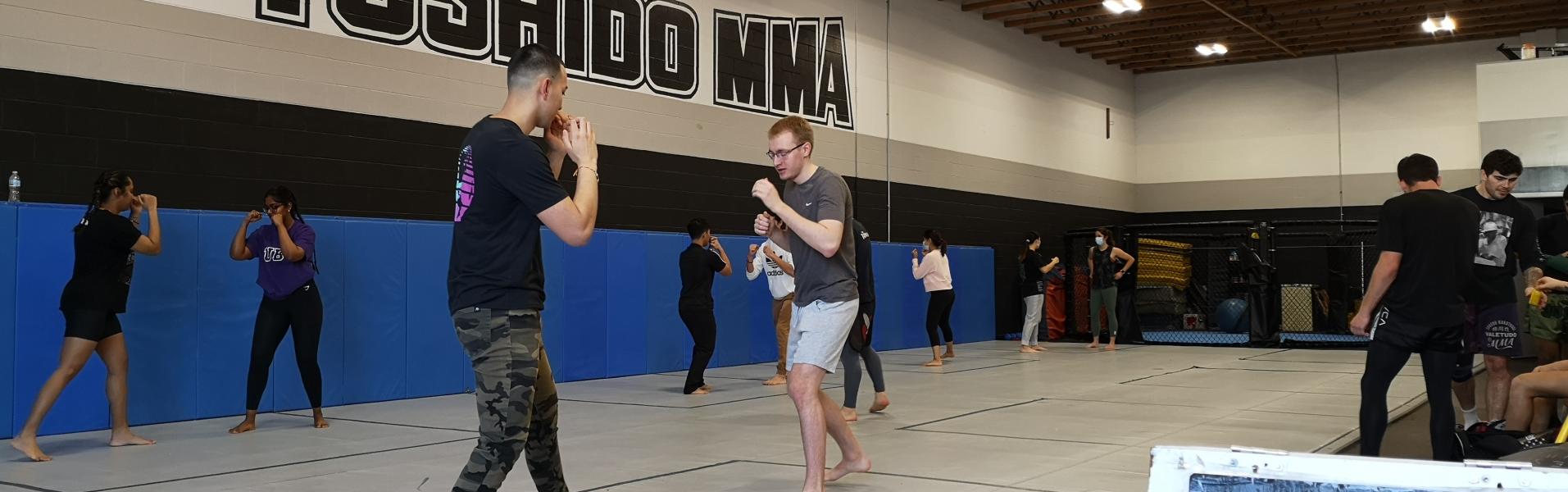 Students squaring-up and practicing traditional stances in the Muay Thai class at Toshido MMA
